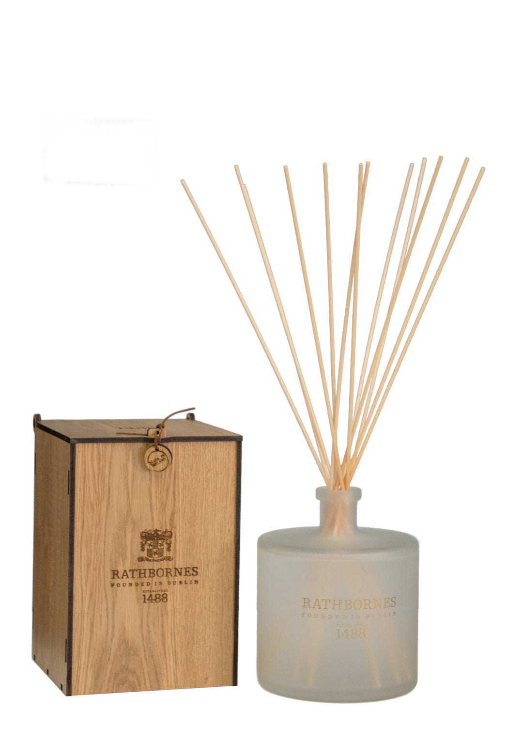 A 3-litre clear glass reed diffuser with long wooden reeds and a wooden box packaging labelled as Rathbornes 1488