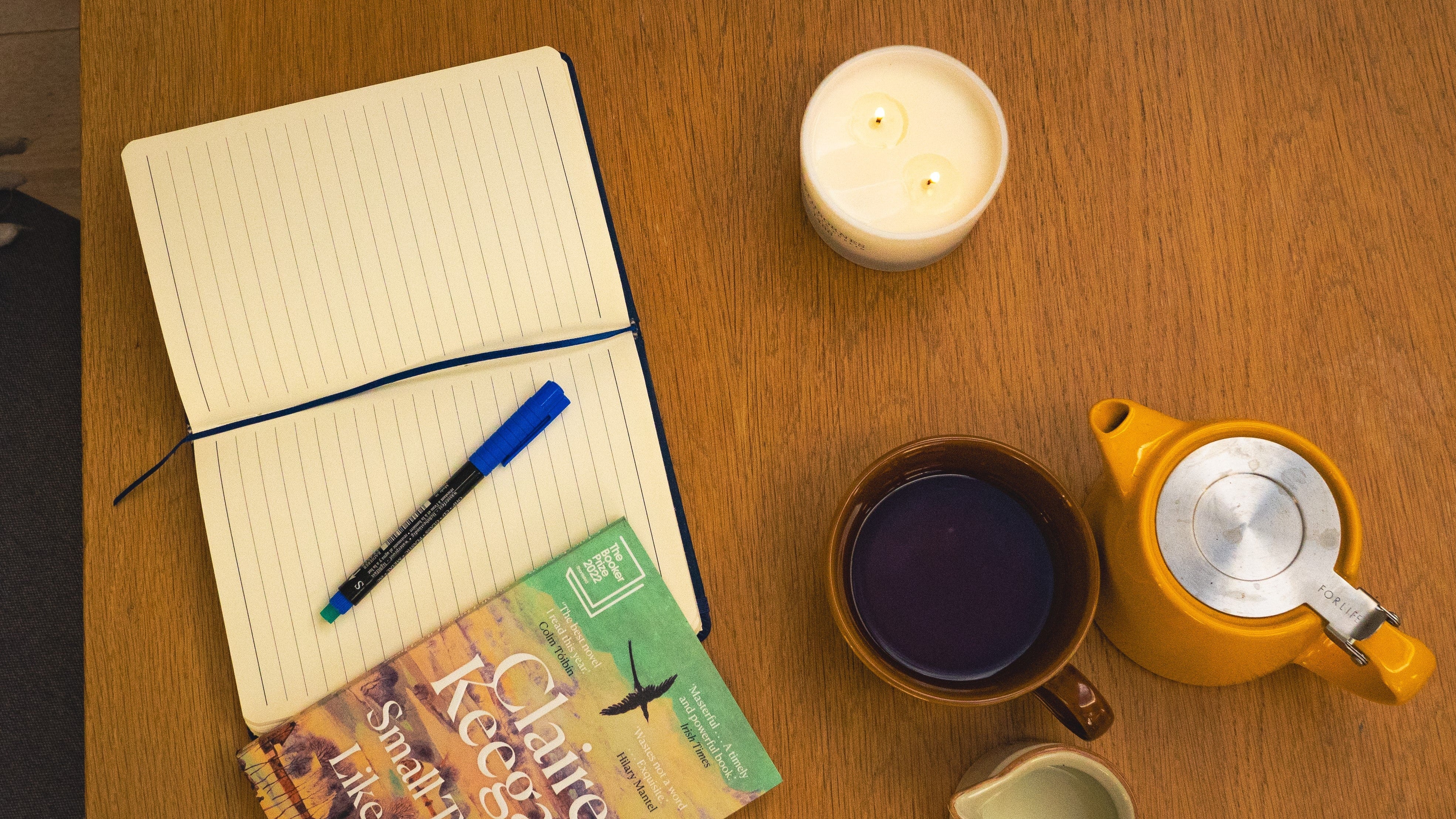 scented Candle, teapot, cup, notebook, pot of milk