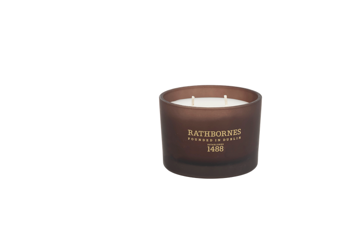 Brown candle with 'Rathborne's' branding with transparent background