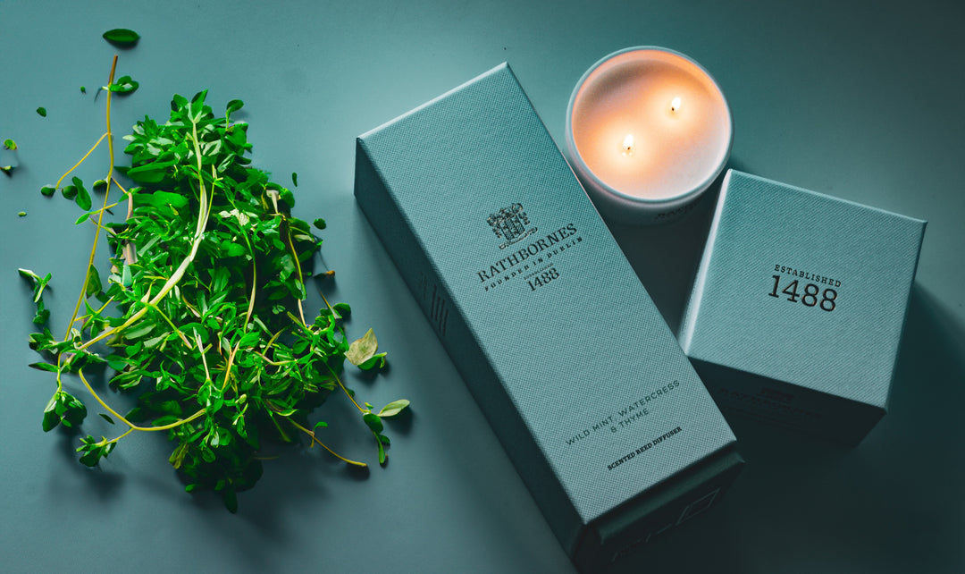 Watercress and Thyme Candle box with candle out lit along with a diffuser box.