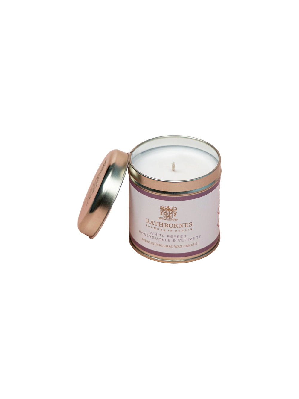 White Pepper Tin candle with lid opened on a white background.