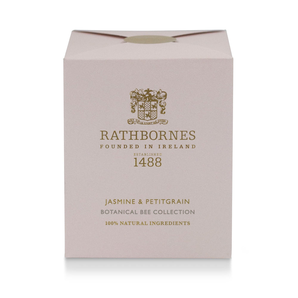 Rathbornes Jasmine & Petitgrain scented candle beside its dusty pink gift box