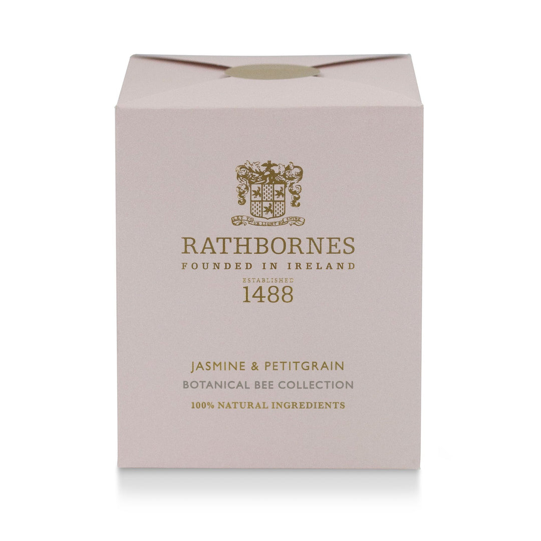 Rathbornes Jasmine & Petitgrain scented candle beside its dusty pink gift box