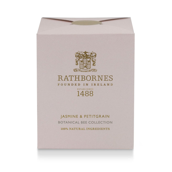 Rathbornes Jasmine & Petitgrain scented candle beside its dusty pink gift box