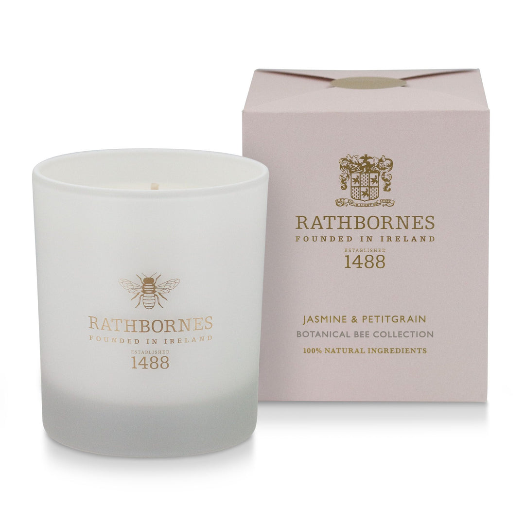 Rathbornes Jasmine & Petitgrain scented candle in frosted white glass with gold bee motif