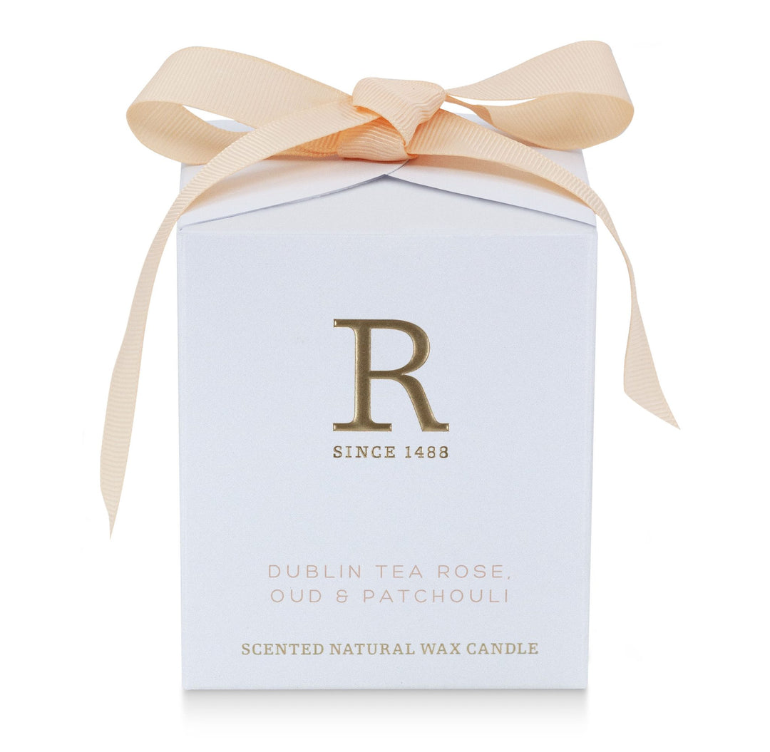 White gift box with blush bow for the Rathbornes Dublin Tea Rose, Oud & Patchouli scented candle