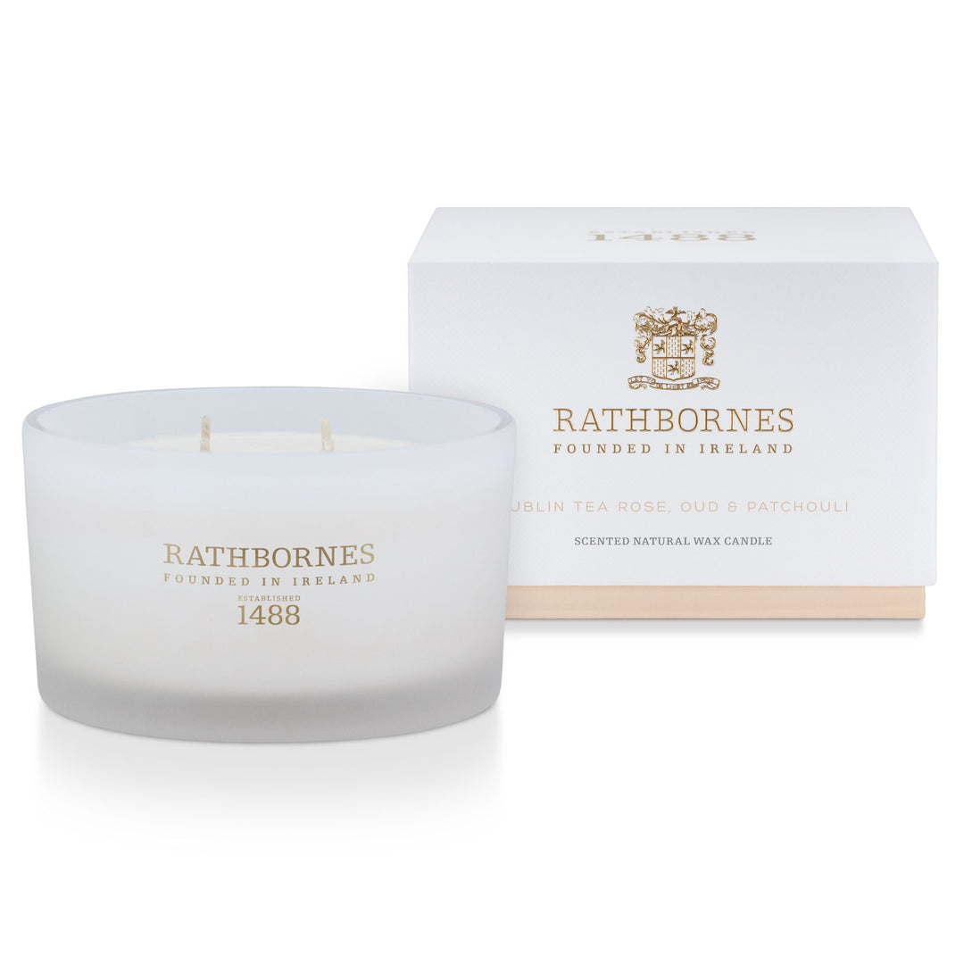 Rathbornes Dublin Tea Rose, Oud & Patchouli luxury scented candle beside its white gift box with blush base
