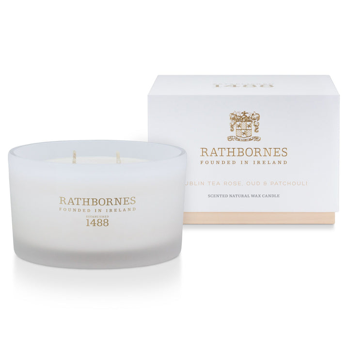 Rathbornes Dublin Tea Rose, Oud & Patchouli luxury scented candle beside its white gift box with blush base