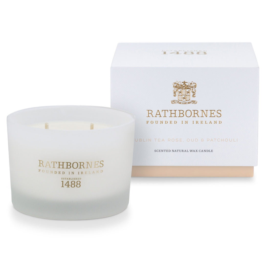 Rathbornes Dublin Tea Rose, Oud & Patchouli classic scented candle beside its white gift box with blush base