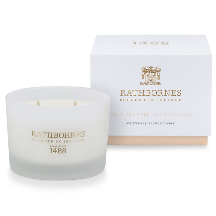Rathbornes Dublin Tea Rose, Oud & Patchouli classic scented candle beside its white gift box with blush base
