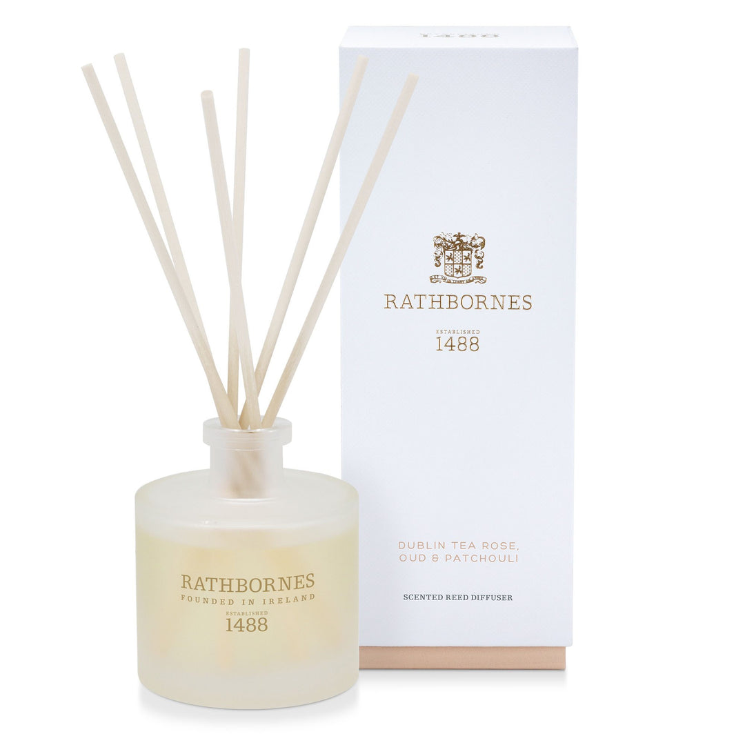Rathbornes Dublin Tea Rose, Oud & Patchouli scented reed diffuser with reeds, beside its gift box