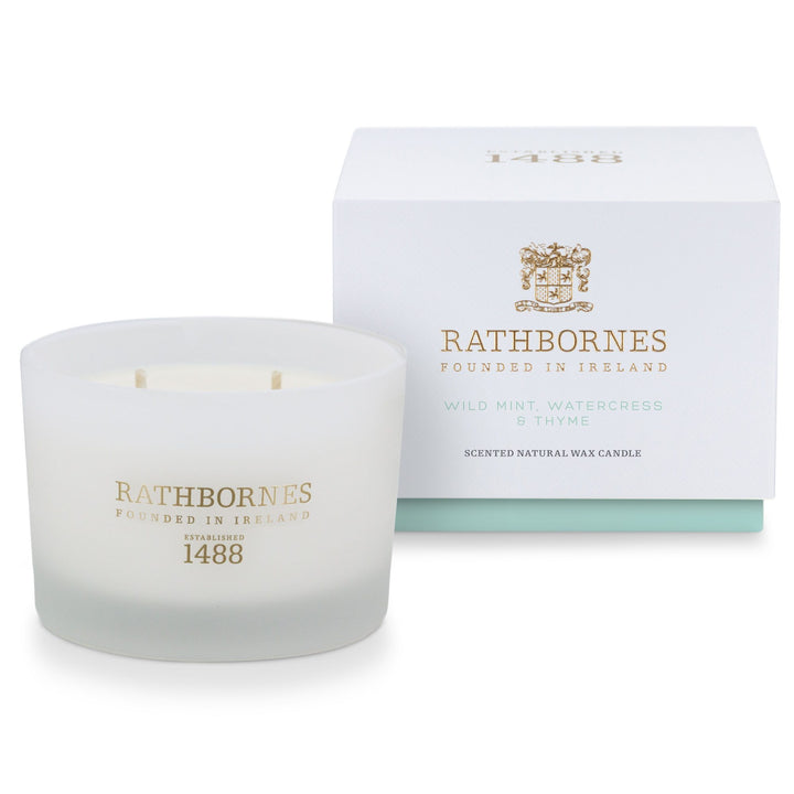 Rathbornes Wild Mint, Watercress & Thyme classic scented candle in frosted white glass next to its gift box
