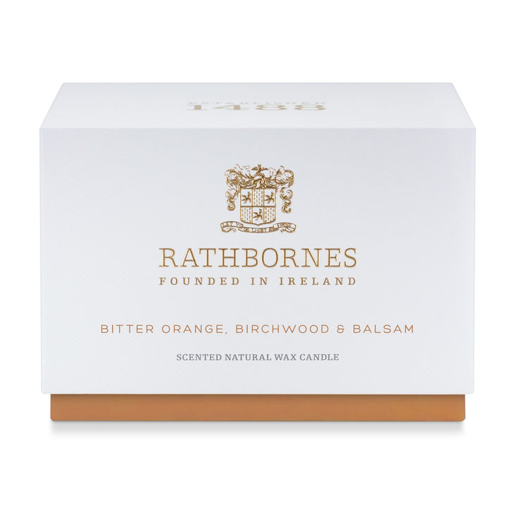 White gift box with amber base for the Rathbornes Bitter Orange, Birch Tar & Balsam luxury scented candle