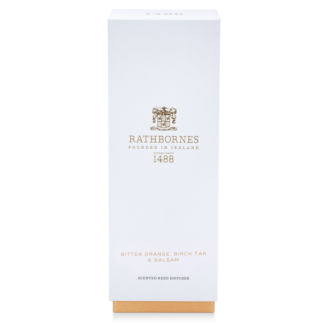 White gift box with amber base for the Rathbornes Bitter Orange, Birch Tar & Balsam scented reed diffuser