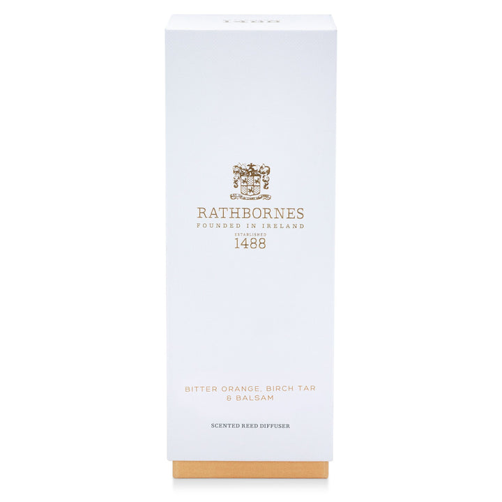 White gift box with amber base for the Rathbornes Bitter Orange, Birch Tar & Balsam scented reed diffuser
