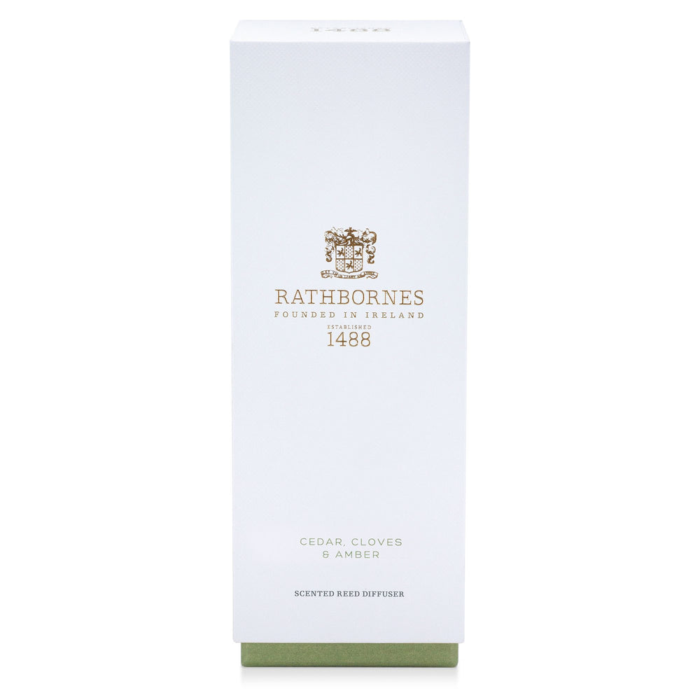 White gift box with green base for the Rathbornes Cedar, Cloves & Amber scented reed diffuser
