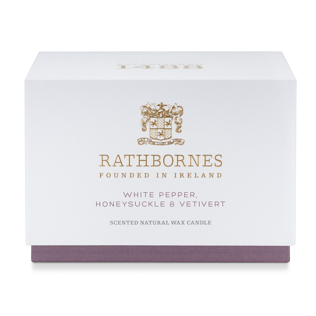 White gift box with mauve base for the Rathbornes White Pepper, Honeysuckle & Vetivert luxury scented candle
