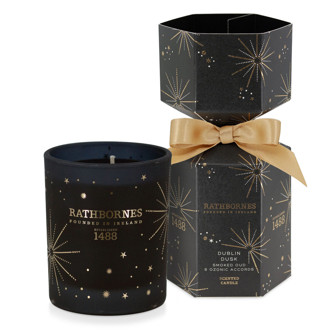 Rathbornes Dublin Dusk Christmas cracker beside its scented candle