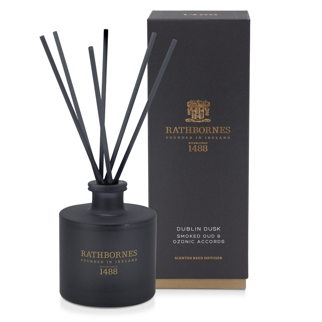 Rathbornes Dublin Dusk (Smoked Oud & Ozonic Accords) scented reed diffuser with reeds, beside its gift box
