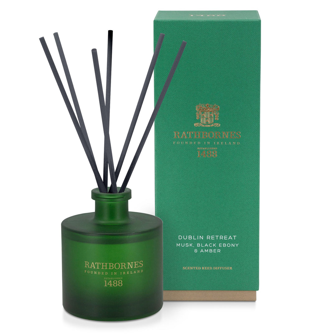 Rathbornes Dublin Retreat (Musk, Black Ebony & Amber) scented reed diffuser with reeds, beside its gift box