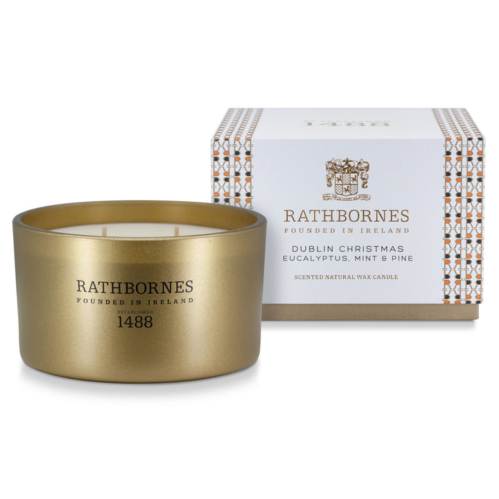 Rathbornes Dublin Christmas (Eucalyptus, Mint & Pine) luxury 4 wick scented candle beside its white and gold patterned gift box