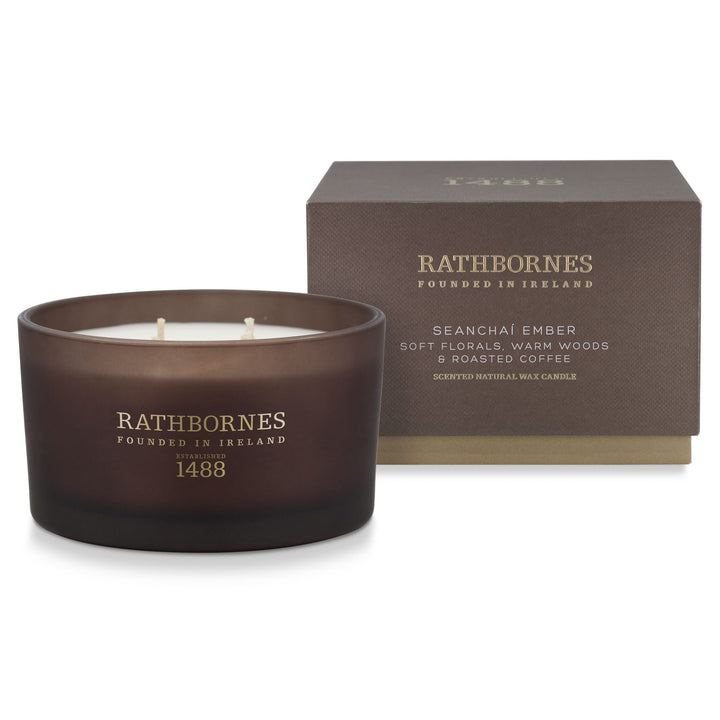 Rathbornes Seanchaí Ember (Roasted Coffee, Soft Florals & Warm Woods) luxury scented 4 wick candle beside its mocha brown gift box