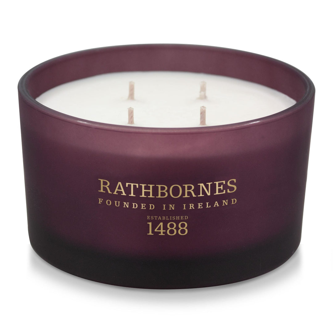 Rathbornes Seanchaí Dún (Ripe Fig, Aged Leather & Sheltering Woods) luxury 4 wick candle in plum glass