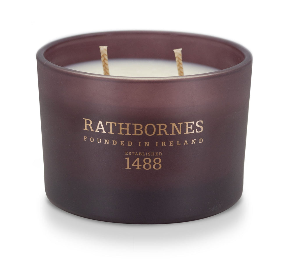 Rathbornes Seanchaí Dún (Ripe Fig, Aged Leather & Sheltering Woods) classic 2 wick candle in plum glass